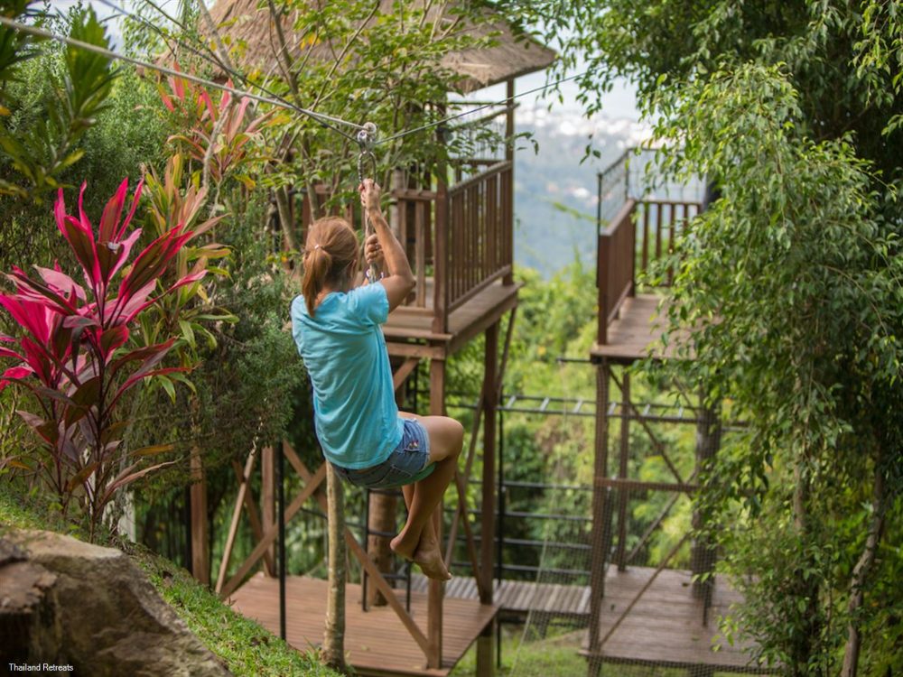 Child on the treehouse zip line at Lime Samui Villas, Koh Samui Child on the treehouse zip line at Lime Samui Villas, Koh Samui